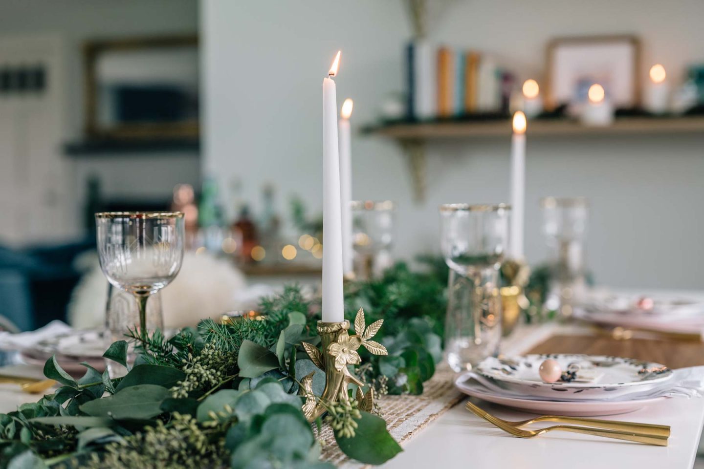 Jess Ann Kirby styles a rustic and minimal holiday tablescape with greenery and glassware from Anthropologie