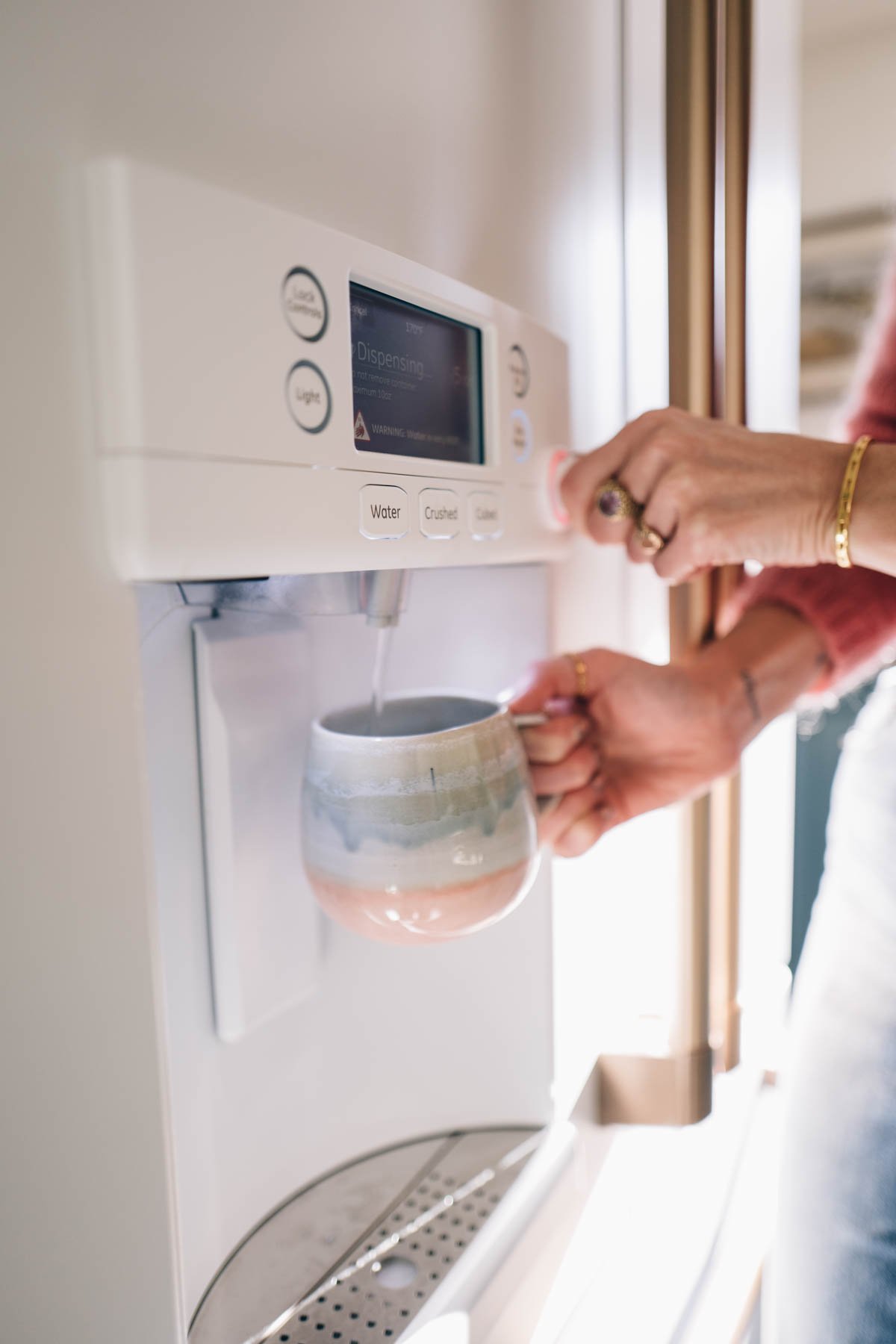 hot water dispenser Jess Ann Kirby uses the hot water dispenser in her new Cafe Appliances fridge for morning tea